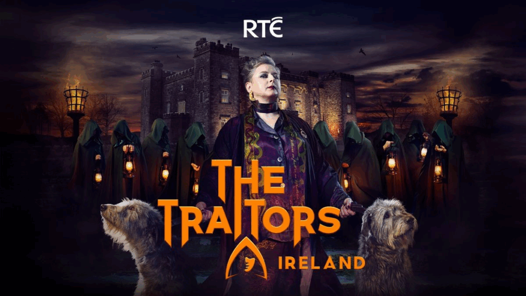 The Traitors Ireland presenter Siobhán McSweeney is pictured in front of Slane Castle with some Irish Wolfhounds, and cloaked Traitors in the background